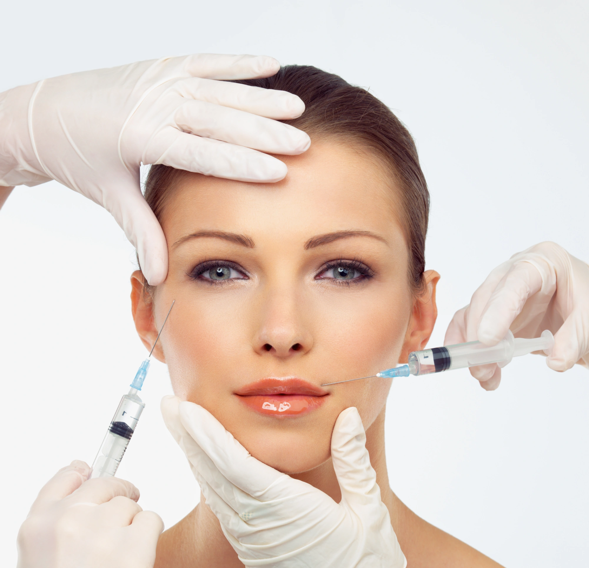 Woman receiving facial beauty treatment