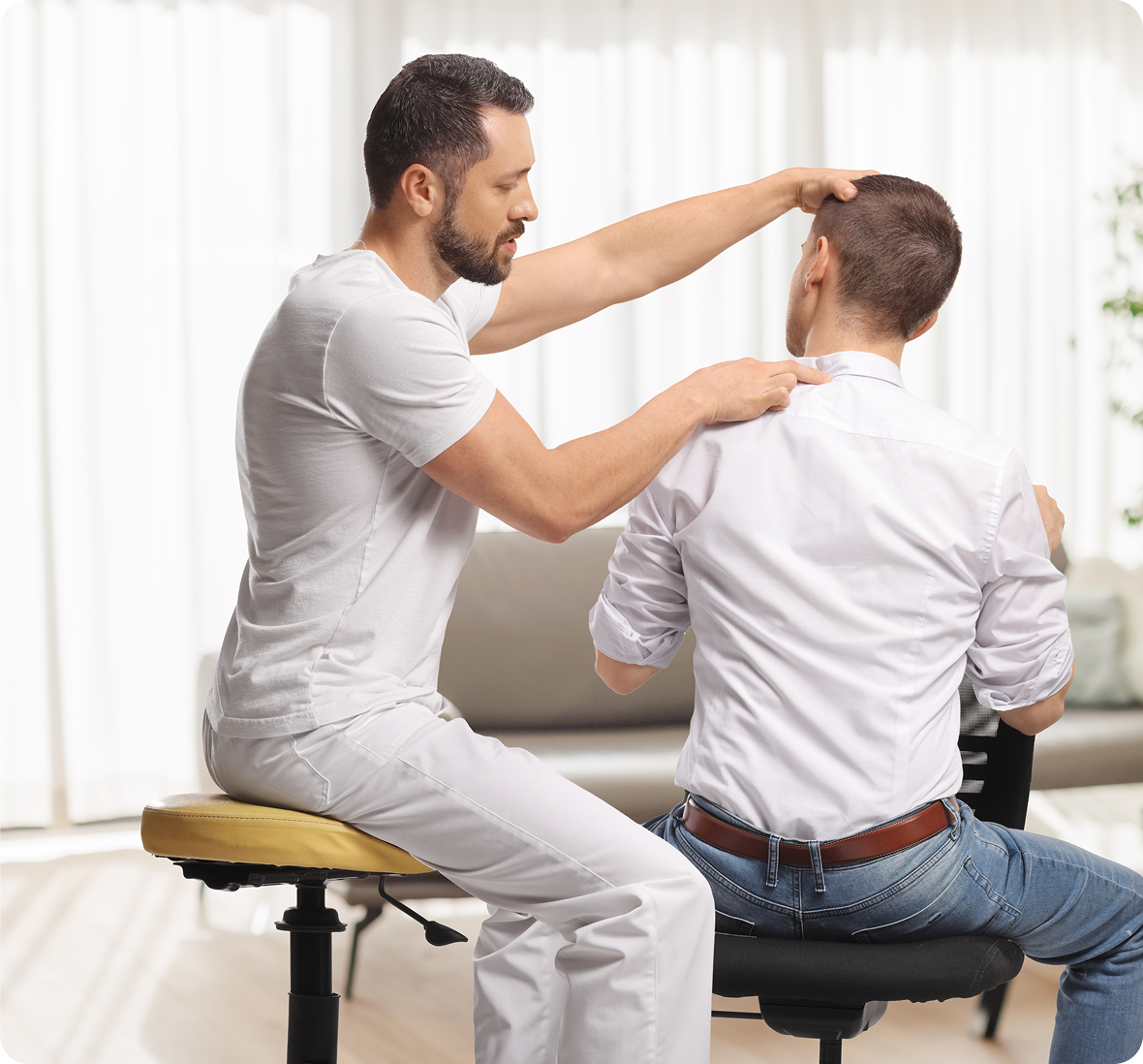 Chiropractor adjusting patient's neck
