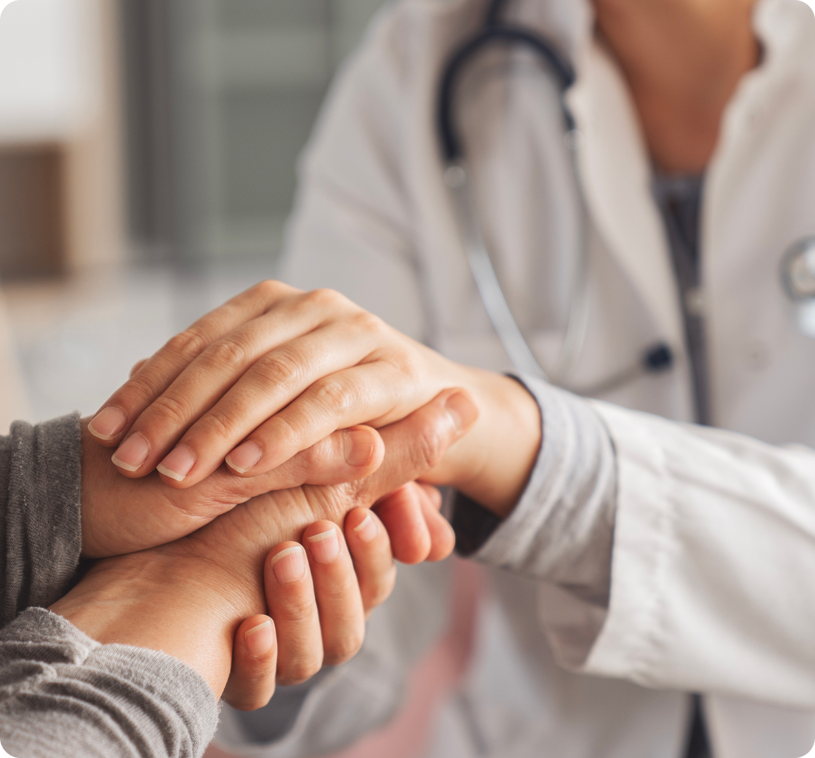 Medical empathy through supportive hand touch.