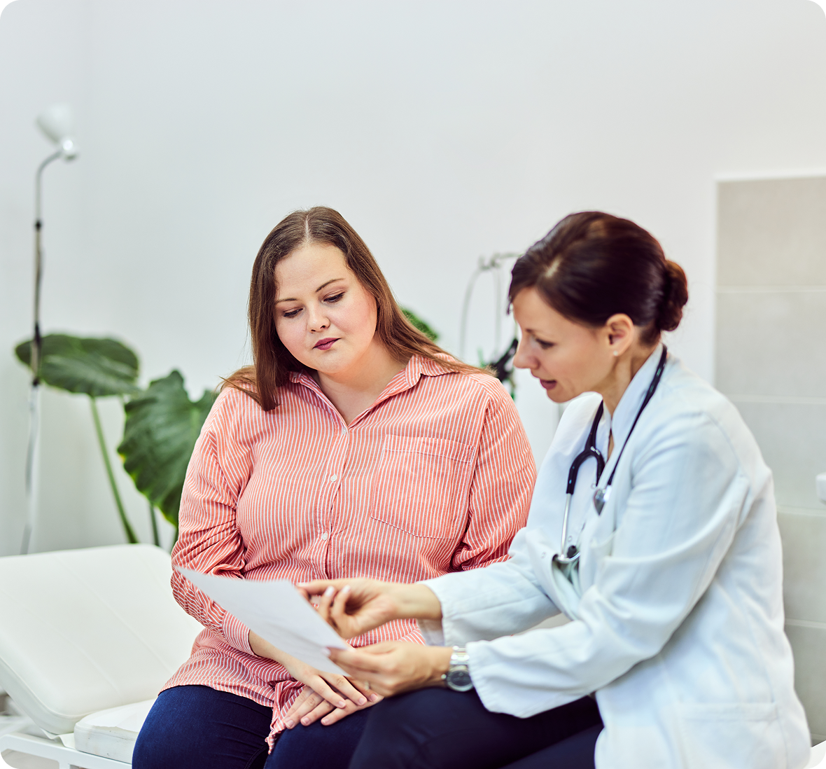 Doctor consulting patient with a document