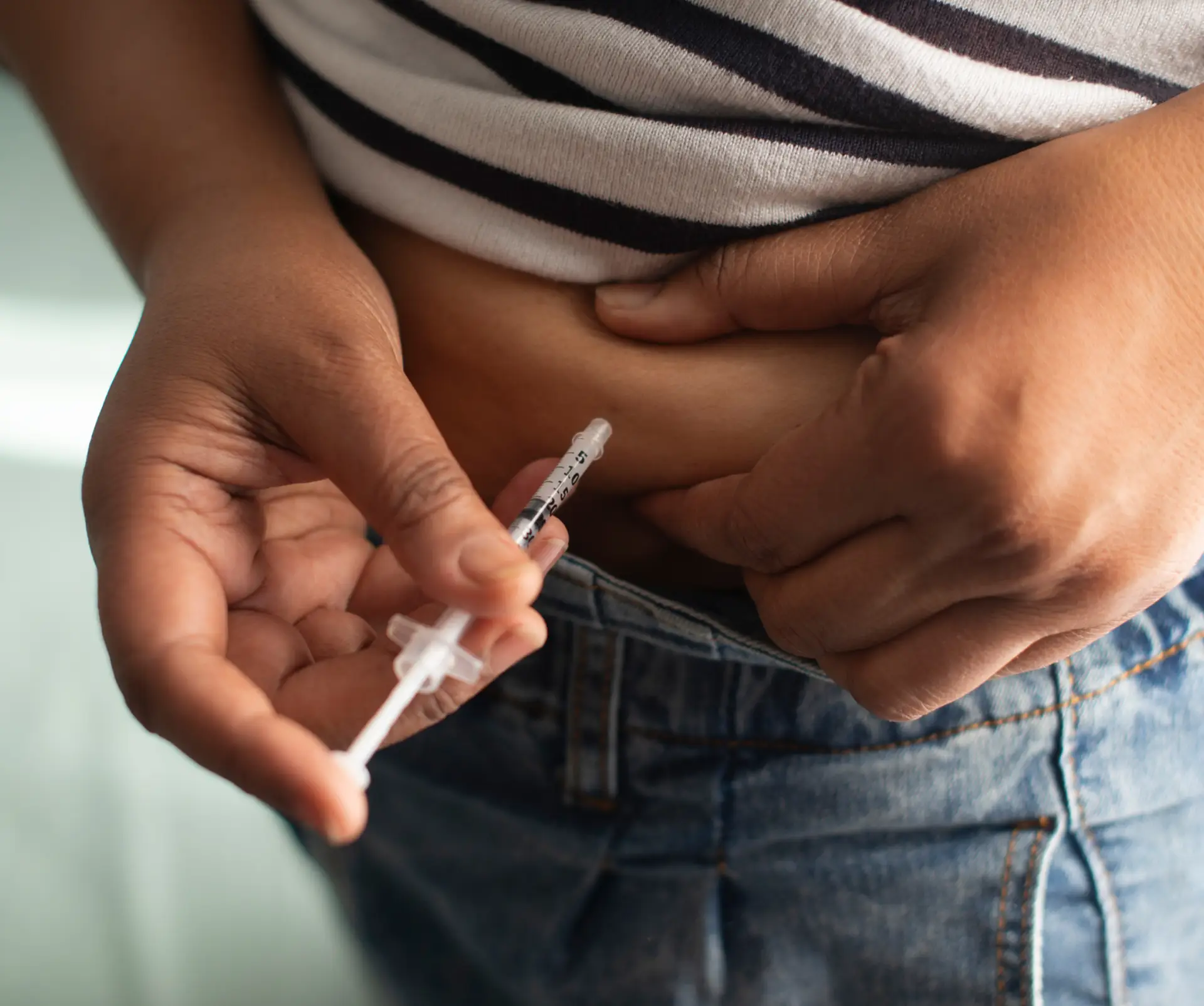 Self-injection in the abdomen