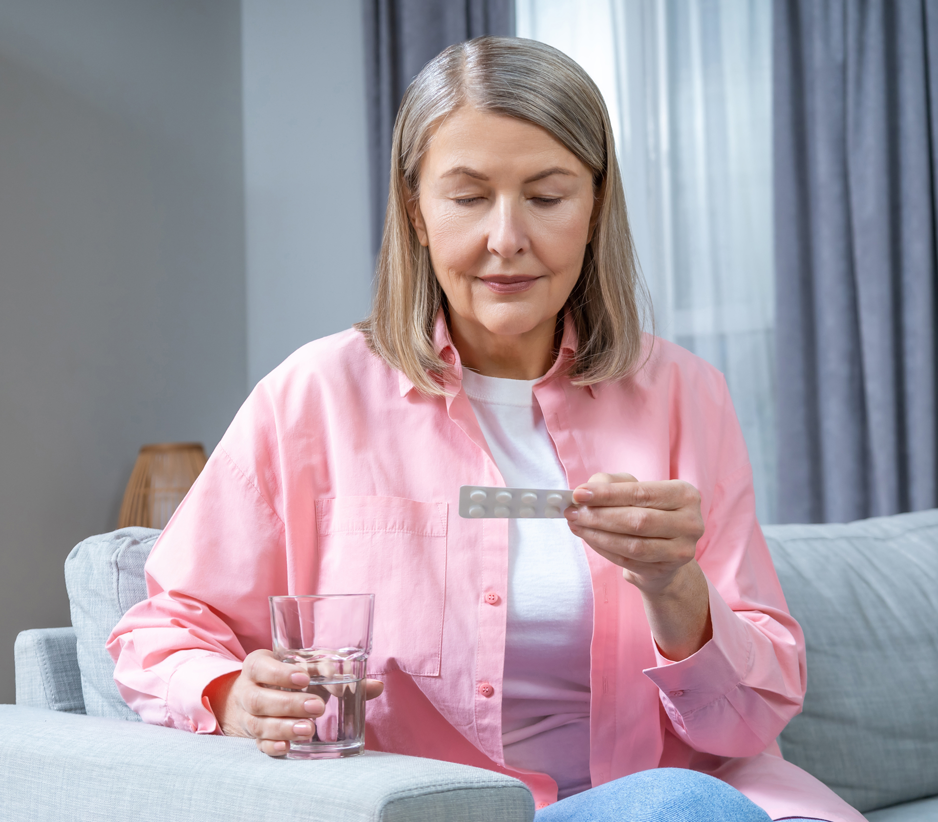 Lady in pink shirt with medication